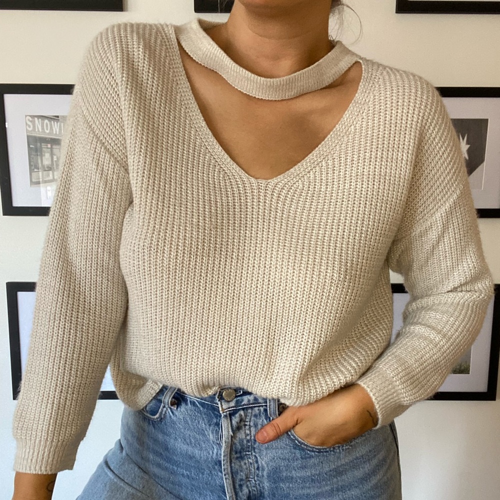 Knit sweater with choker neck detail. Size M/L. Soft knit and not itchy.